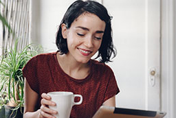 Woman with coffee cup in hand