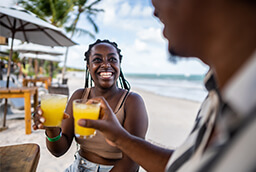 woman enjoying a drink at all-inclusive resort